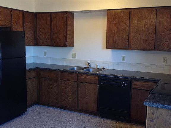 Kitchen with newer refrigerator