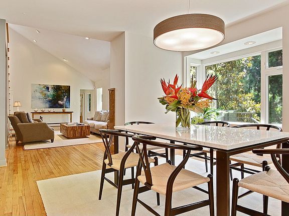 Separate dining room flows into living room and kitchen