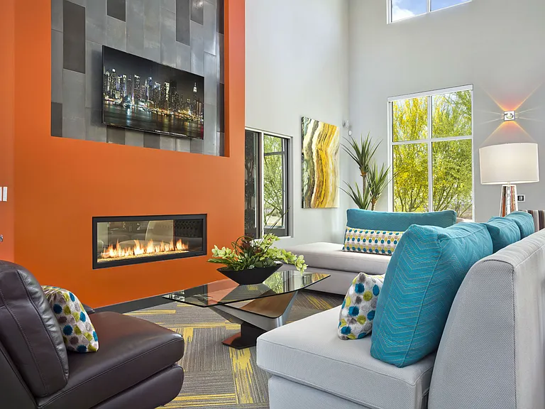 Resident lounge with TVs and ample seating