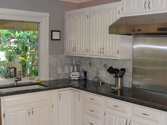 Granite counters and stainless vent hood
