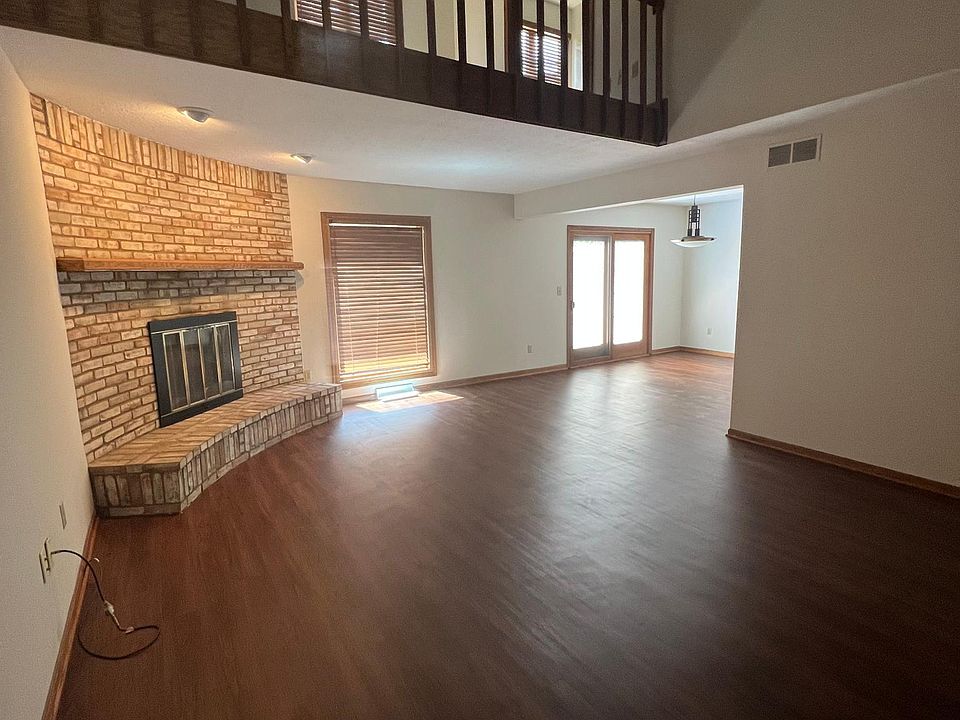 Main living room with high ceilings and new flooring