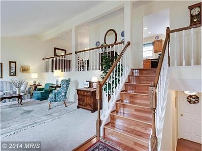 Living Room With Stairs to Upper Level