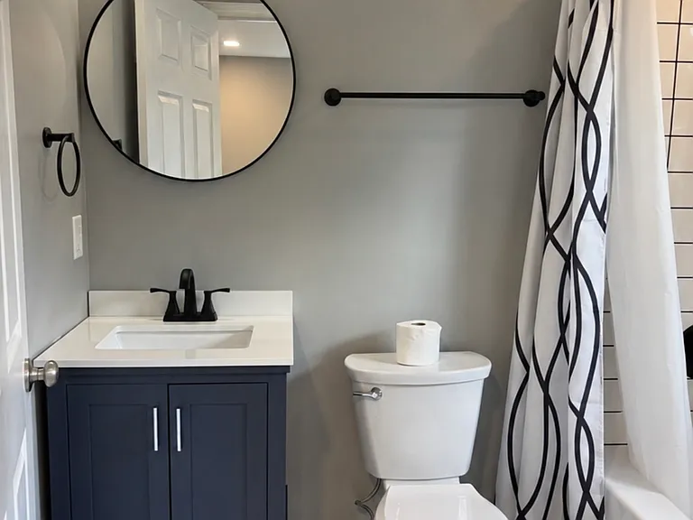 Ensuite bathroom with full bathtub and shower