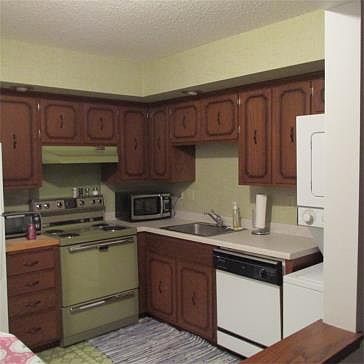 Lots of cabinet space and room for a kitchen table. Refrigerator is new within 3 months