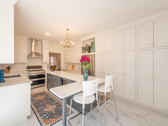 Updated kitchen with ample countertops, pantry and gas stove.