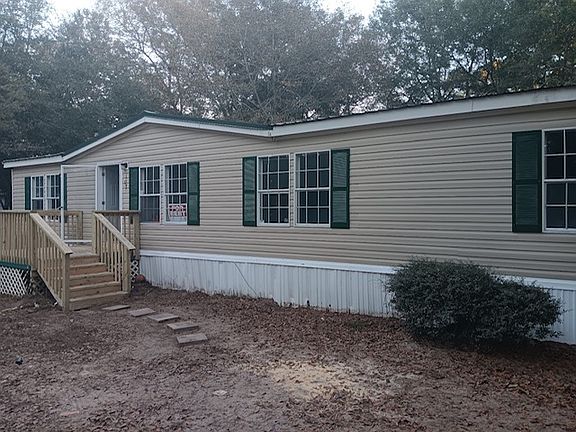 DOUBLE WIDE MOBILE HOME 3 BED ROOMS AND 2 FULL BATHROOMS.
