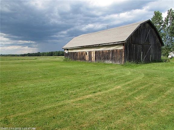 Large 8 stall barn has a tack room and plenty of storage above!