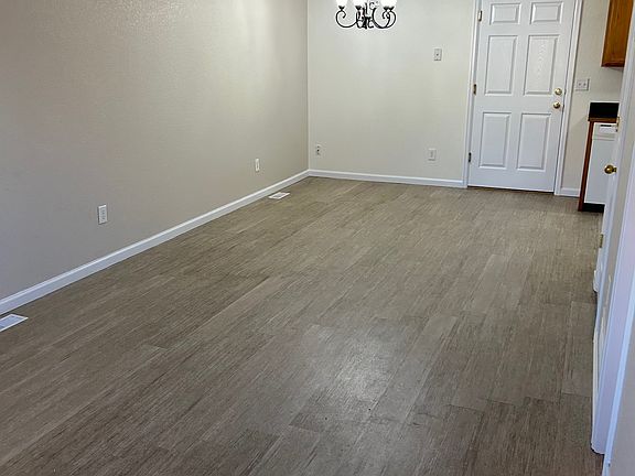 Main level living room with dining room.