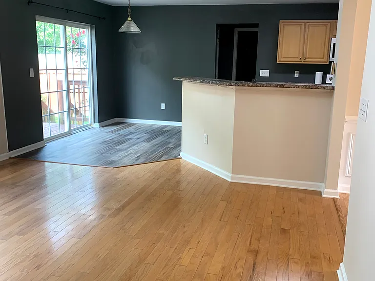 Living room looking into breakfast area and kitchen bar