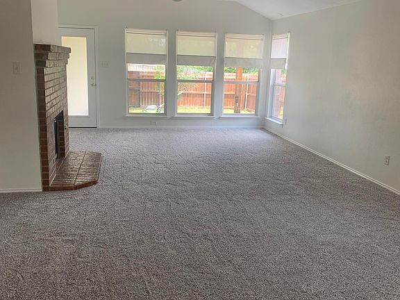Large, bright family area with fireplace.