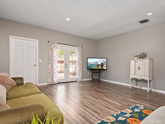 The living room has ample space for all your furniture and entertaining needs.