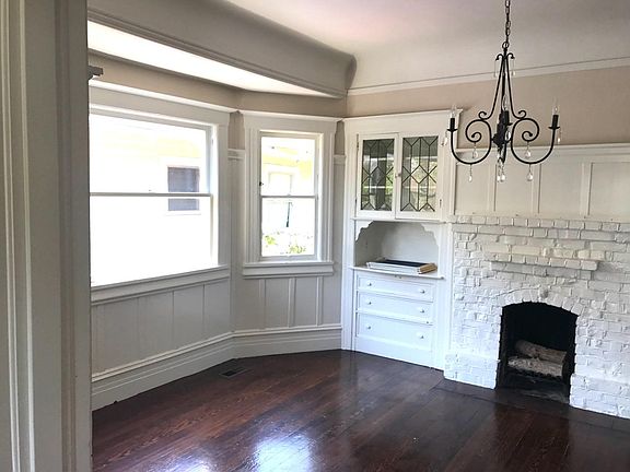 dining room w built in storage & working fireplace
