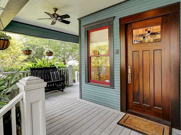 Great front porch with 2 way access to the yard.