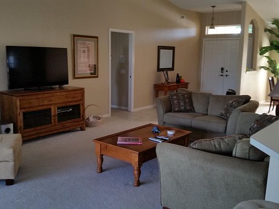 Living room &foyer with tall cathedral ceilings