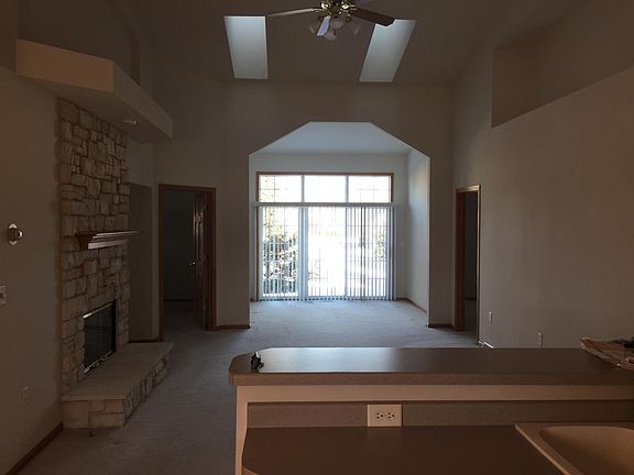 Living room and sun room with sky lights