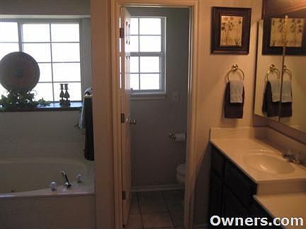Master Bathroom with Jetted Cultured Marble Tub