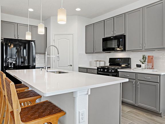 Enjoy functionality with the large kitchen island and a spacious corner pantry.