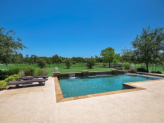 Huge Salt Water Interior Pebble Finished Pool With Ledge. Plenty Of Decking.