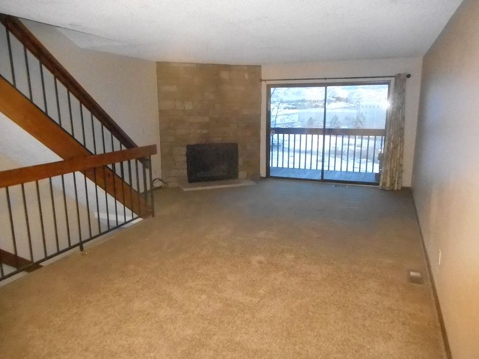 ...the living room with wood burning fireplace.