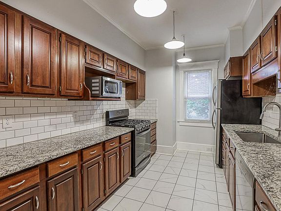 Updated kitchen with SS appliances and tons of cabinet space