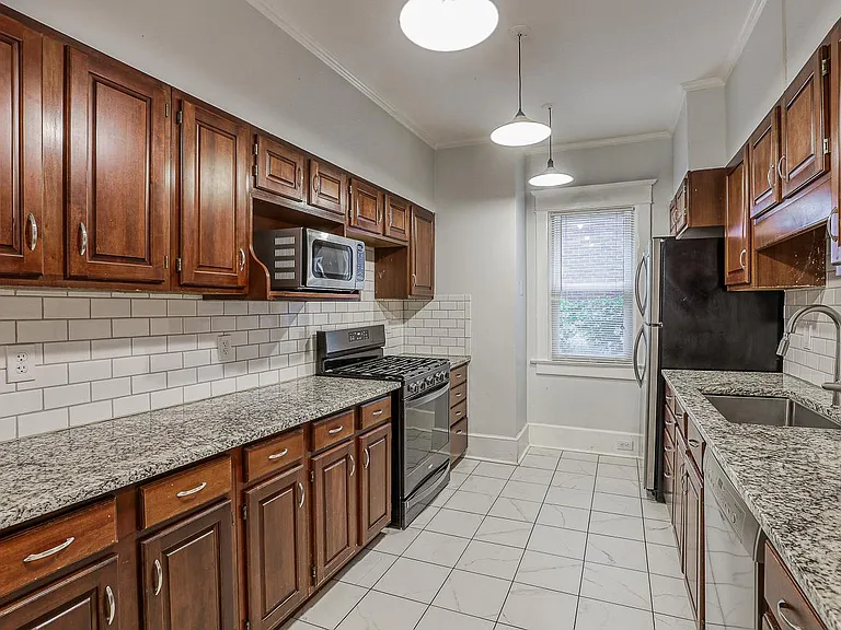 Updated kitchen with SS appliances and tons of cabinet space