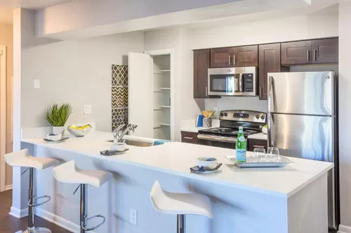 Kitchen (cabinets & appliances vary) - Amalfi Apartment Homes