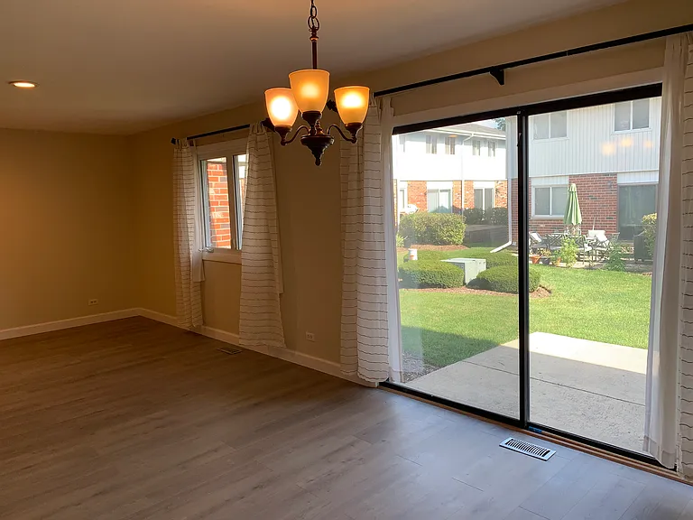 Dining area w/ a sliding door to the beautiful backyard