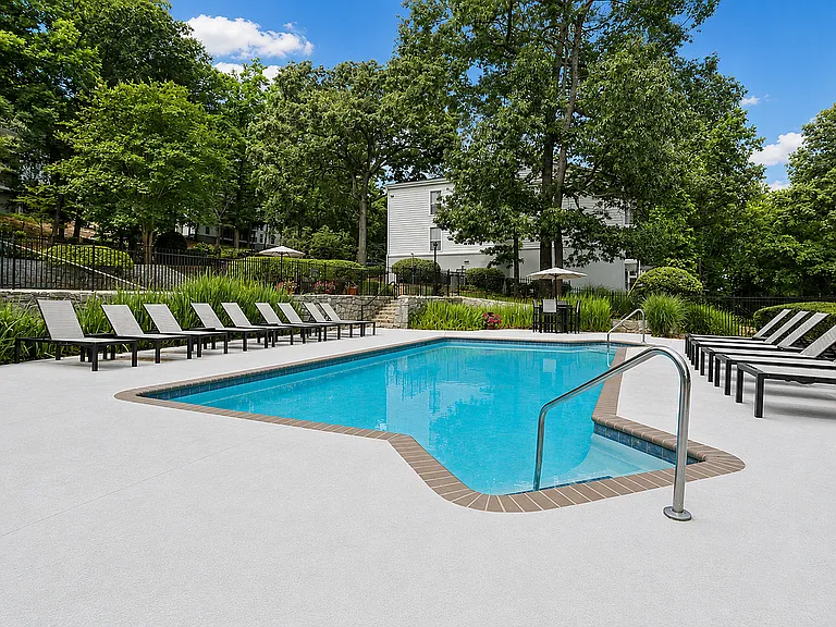 Unwind poolside with comfortable lounge seating.