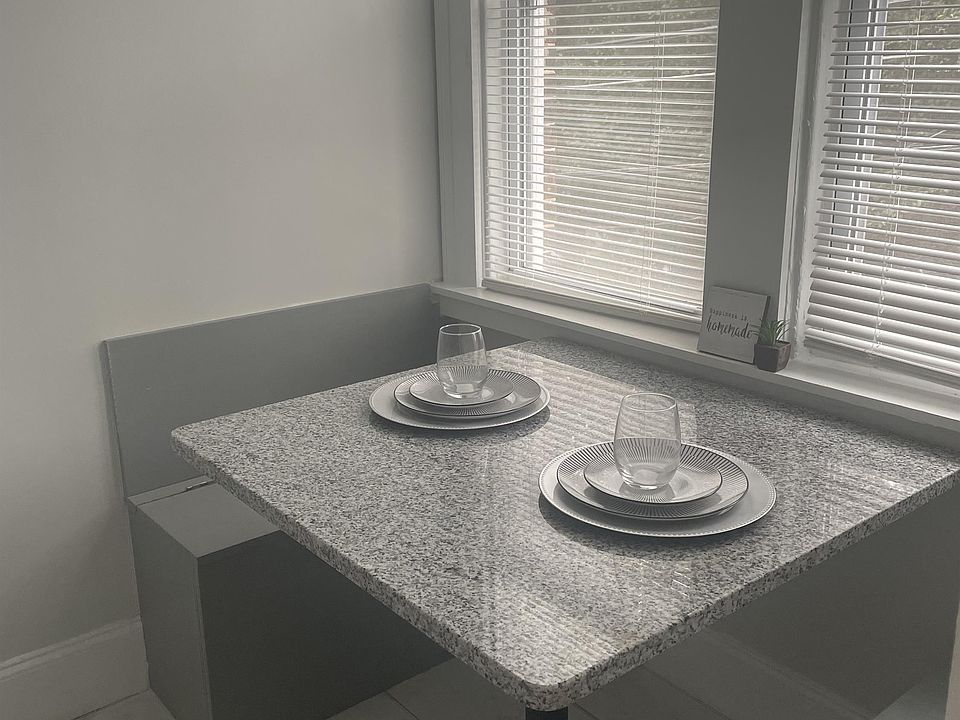 Built in kitchen table with bench seat that open for additional storage