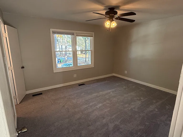 Spacious front bedroom view
Ceiling fan
Energy-efficient windows
Agreeable gray throughout with gloss white trim