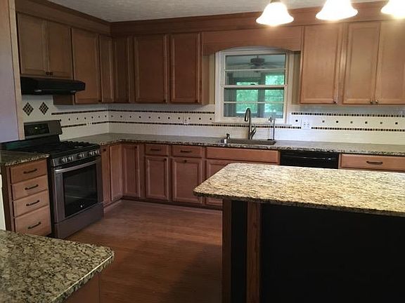 Kitchen. Window looks out to the screened in porch and backyard.