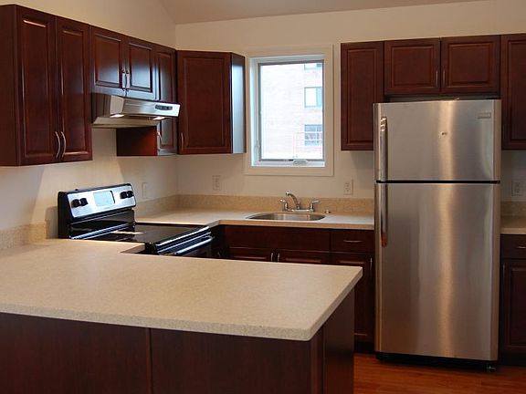 Brand new kitchen with stainless steel appliances and vaulte