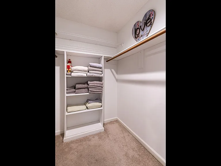 This is just one of two large walk in closets. The one upstairs in the large bonus bedroom also has tons of attic space for your use!