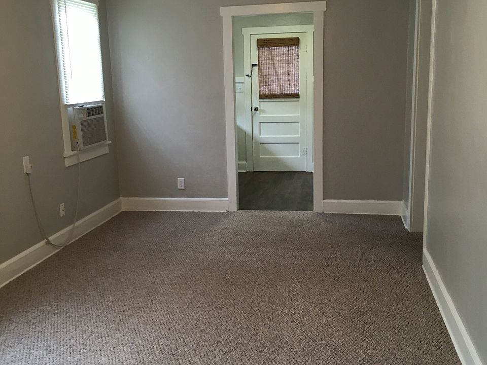 Living room of Dade city apartment showing back door