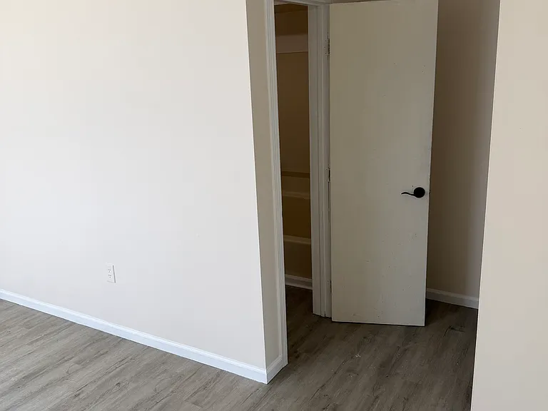 View of bathroom door from bedroom