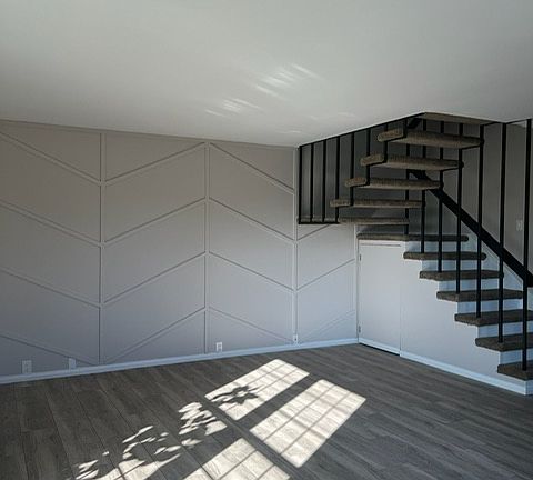 Custom built additional storage area under the stairs