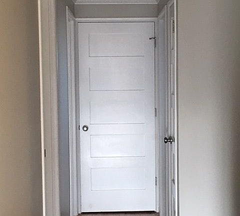 Hallway with laundry at end