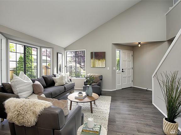 Living room and formal dining area shown here. Vaulted ceiling! 