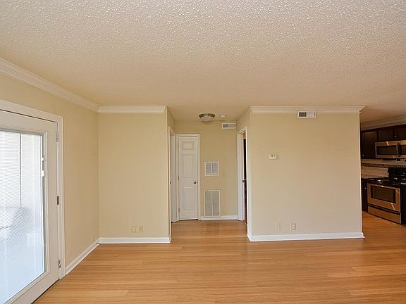 Experience the elegance of this open-concept living space, blending warmth and modernity.
