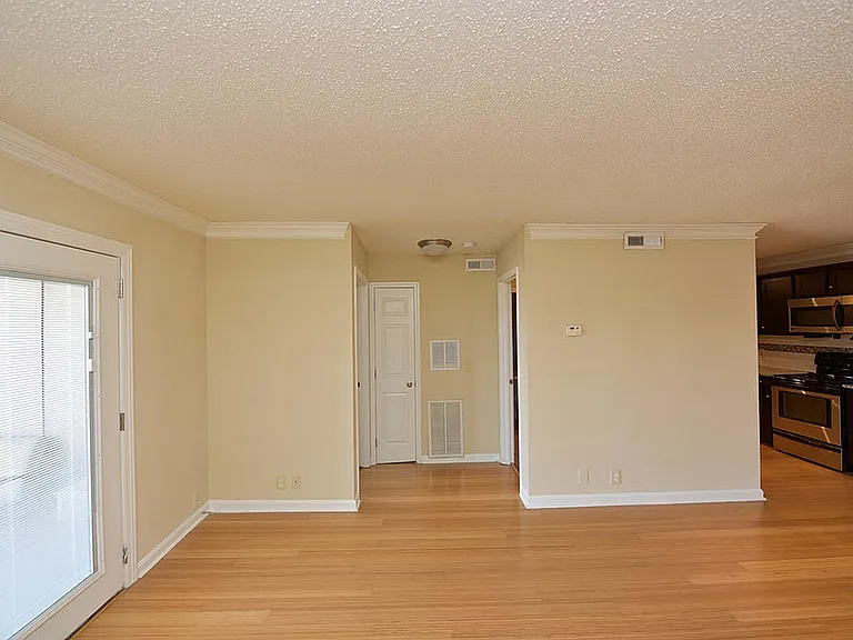 Experience the elegance of this open-concept living space, blending warmth and modernity.