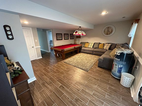 Living room area with pool table.
