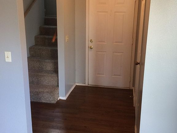 Entry and stairs, half bath is on the right.