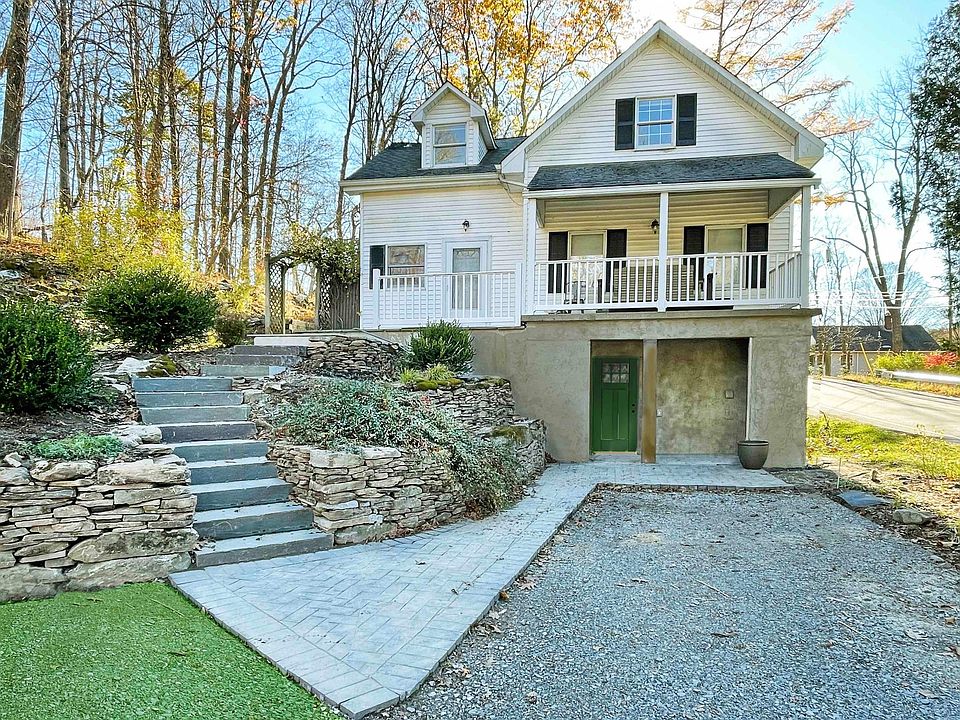 The house is located in a charming corner of Hampton Twp. Drive up to the new main covered ground floor entrance. The path to the backyard, kitchen door and covered porch are on the second level.