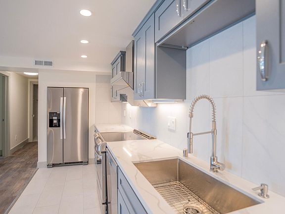 All new appliances, tile backsplash, powerful range hood and more