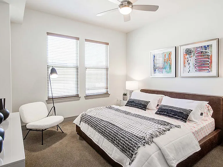 Griffis Uptown apartment bedroom with plush carpet.