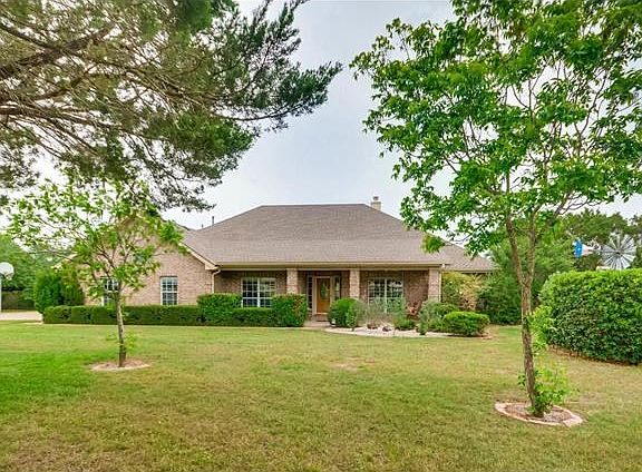 One story with flexible floor plan. 3 bedrooms, office, game room and living room with bricked wall 