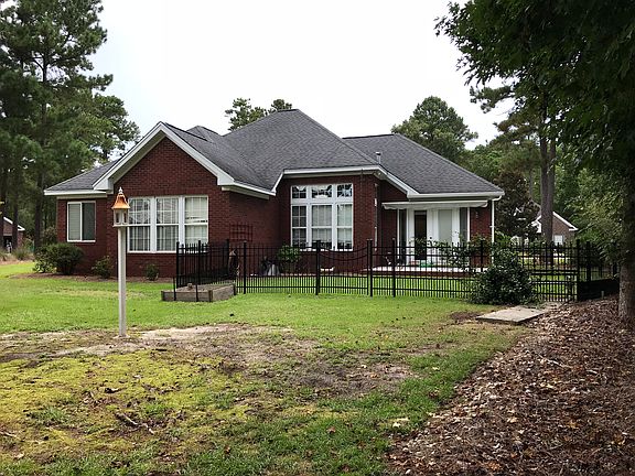 Back with wooded lot behind