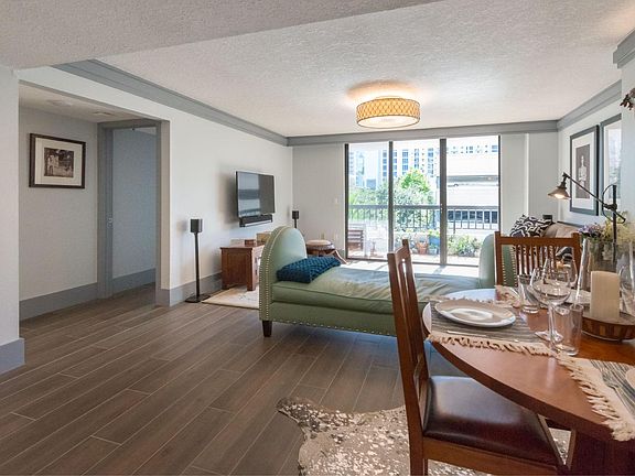 Living Room and Dining Area with view of Downtown Orlando.