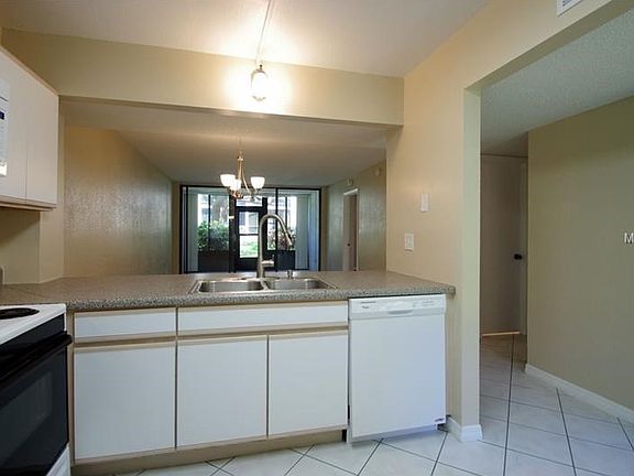 Kitchen opens to dining and living areas.
