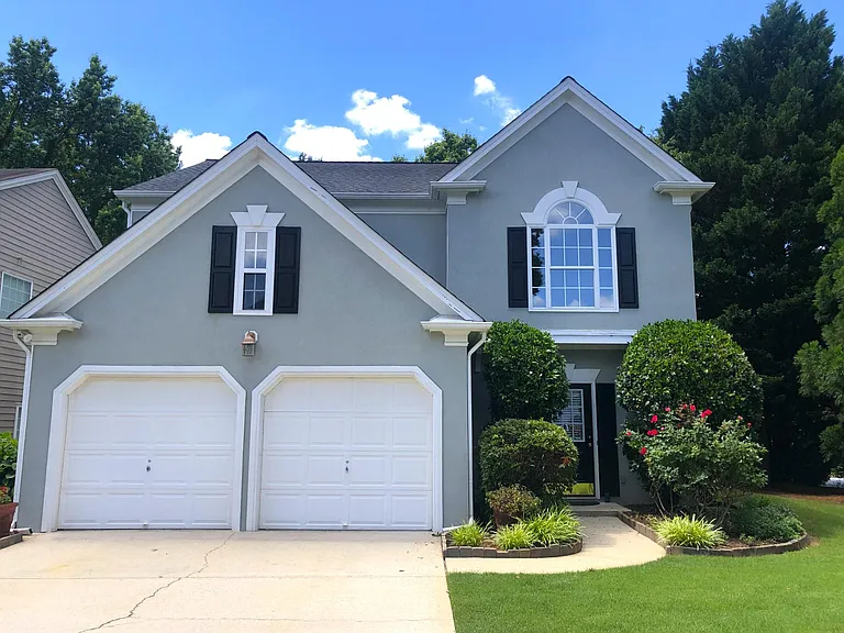 Elegant Wellington home in one of Johns Creek's most sought-after swim and tennis communities, featuring spacious living, mature trees, and a peaceful corner-lot feel just minutes from top-rated schools, parks, dining, and shopping.